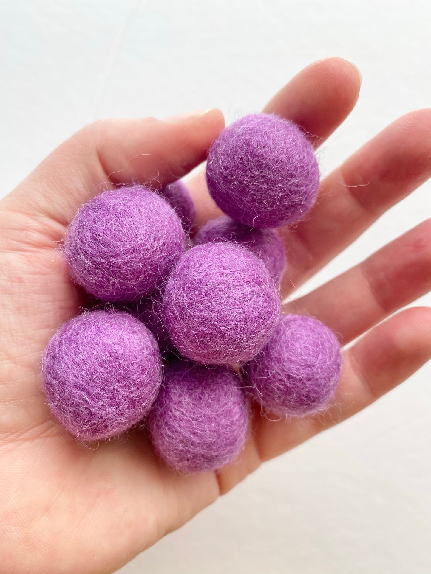 purple felt poms