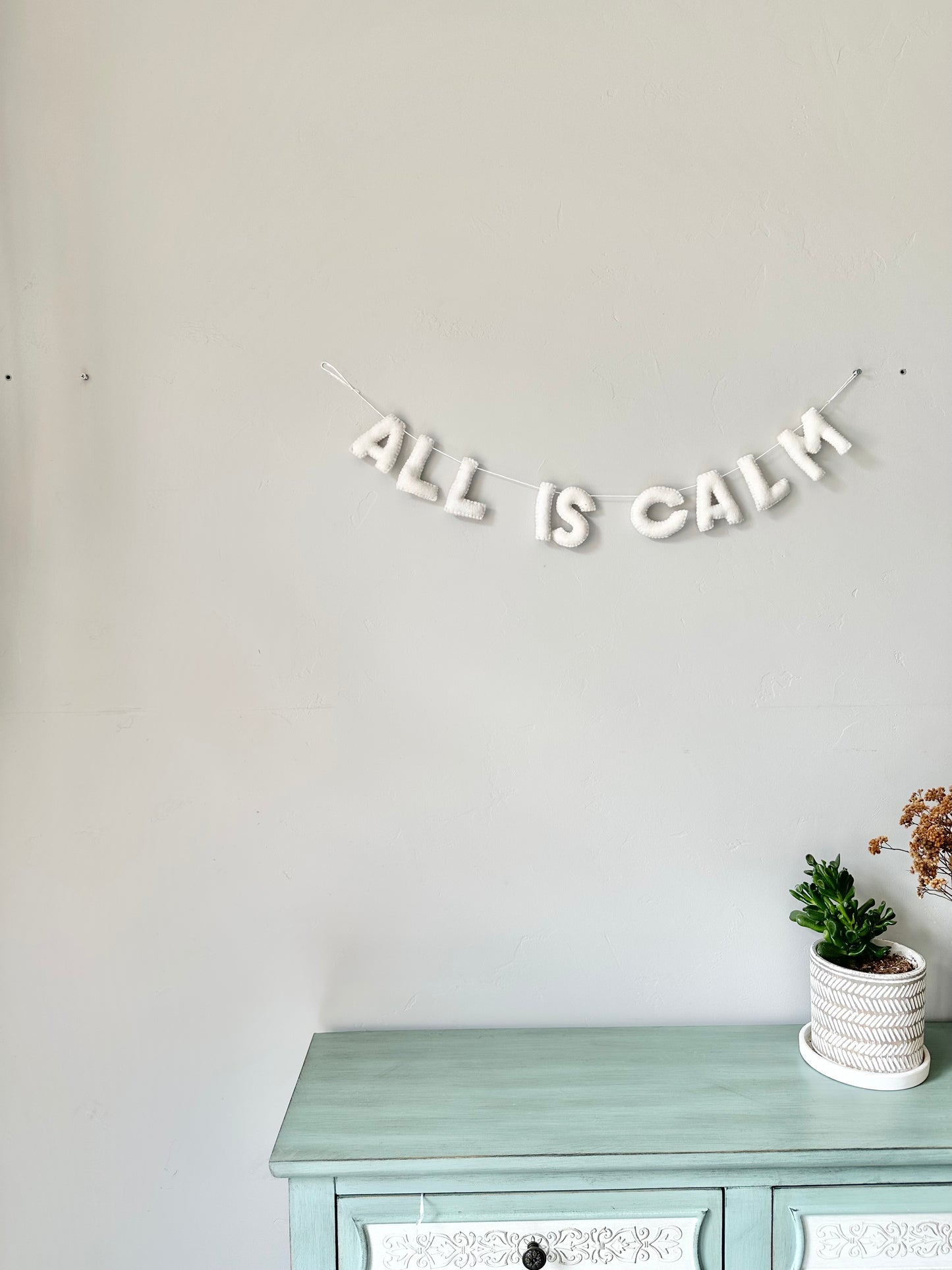 ALL IS CALM felt banner - white letters